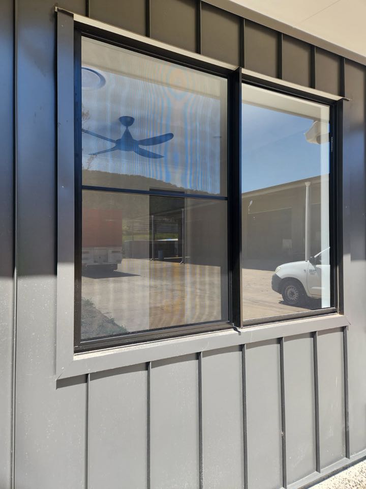 Window in grey commercial cladding